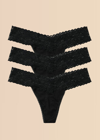 Black DreamEase™ Low Rise Thong 3-Pack Flat Lay on Cream - Lace Thongs | Hanky Panky