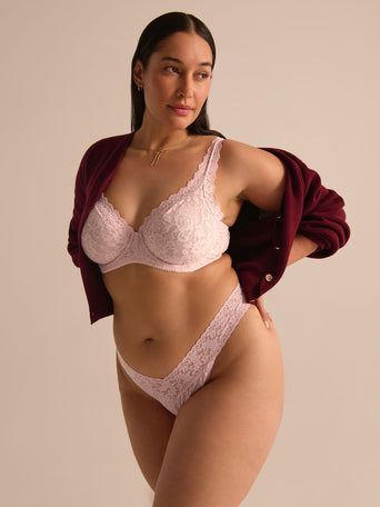 Blushing Rose pink Signature Lace® underwire bra with matching thong, styled with burgundy cardigan - On Model | Hanky Panky