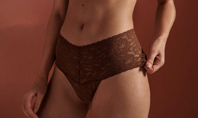 A woman wearing a Hanky Panky Retro Thong in the color Macchiato