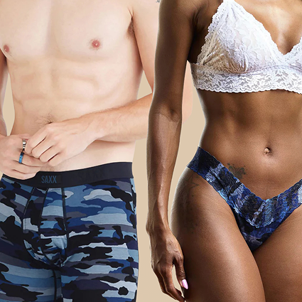 Two people wearing blue camouflage underwear with a neutral background