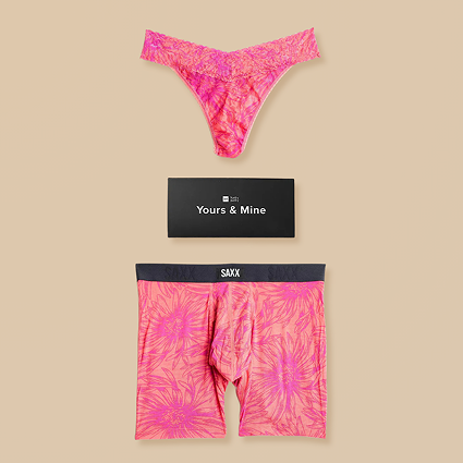 Pink floral underwear set with 'SAXX' branding and a black box labeled 'Yours & Mine' on a beige background.