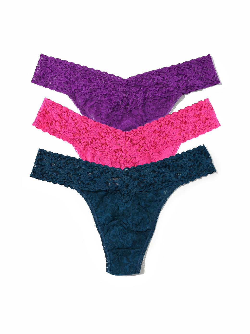 Three pairs of lace underwear in purple, pink, and blue on a white background