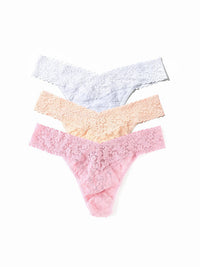 Three pairs of women's underwear in pink, yellow, and light blue on a white background.