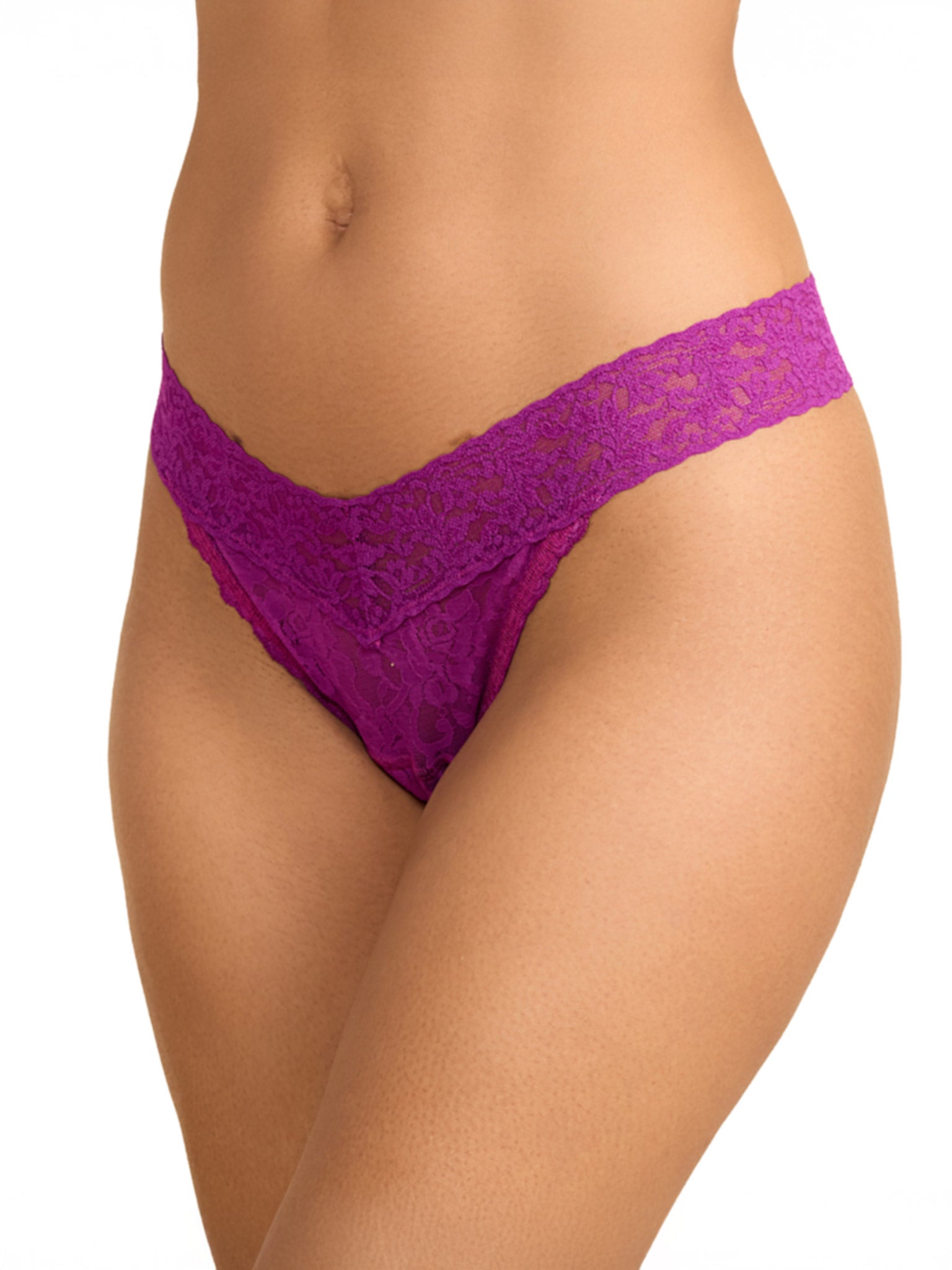  Model facing side wearing Signature Lace® Original Rise Thong Boysenberry Purple with white background