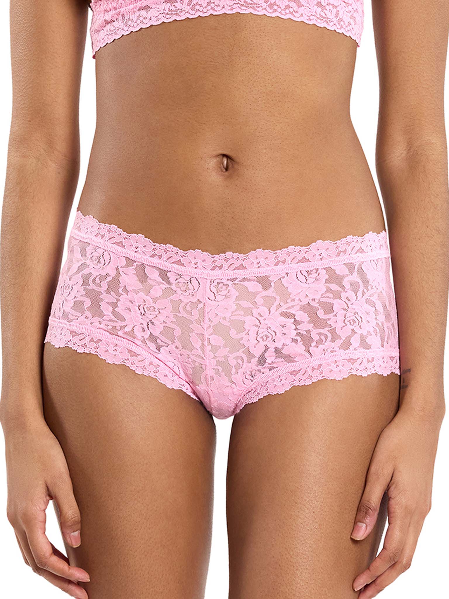 Pink lace underwear on a white background