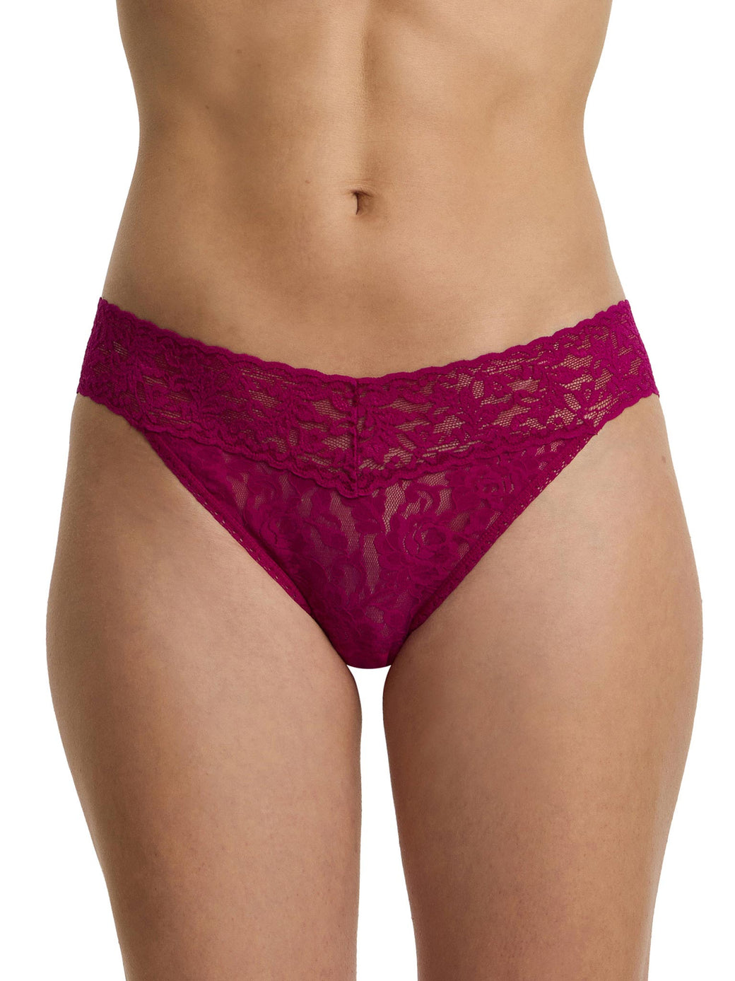 Purple lace underwear worn by a person on a white background