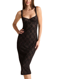 Black lace dress worn by a model on a white background
