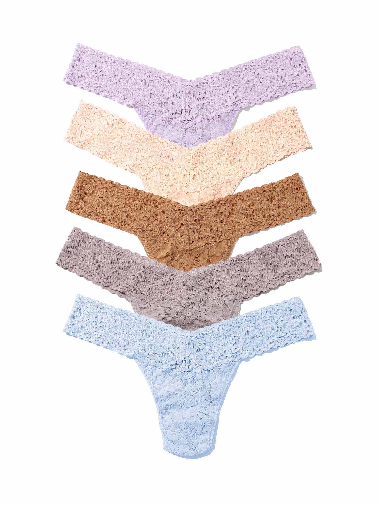 Five pairs of lace thongs in different colors on a white background