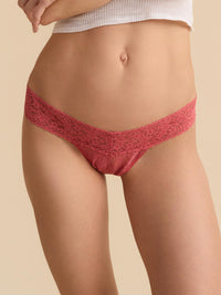 Red lace underwear on a beige background
