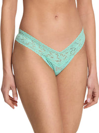 Teal lace underwear on a white background