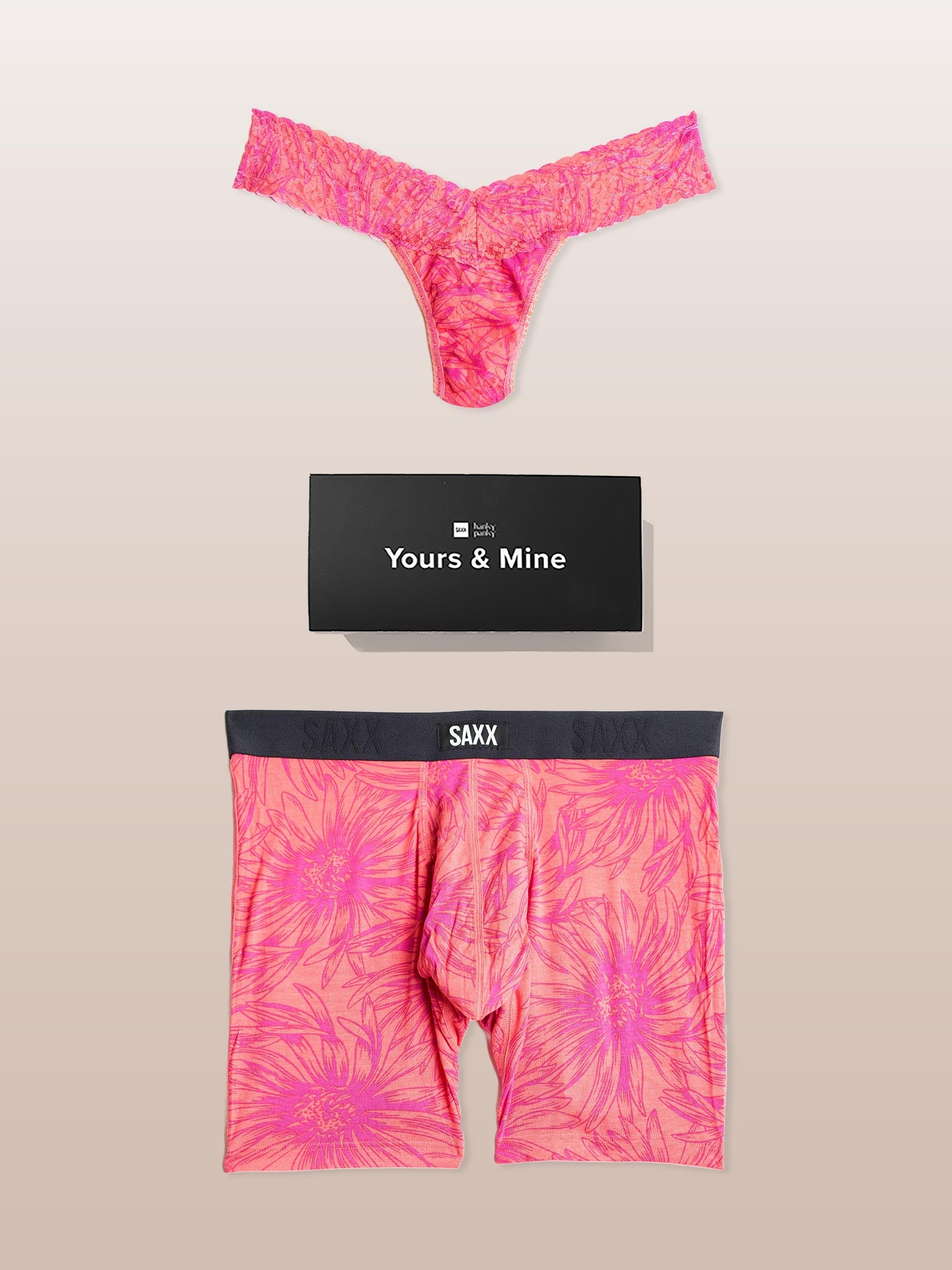 Pink tie-dye underwear set with SAXX branding on a beige background