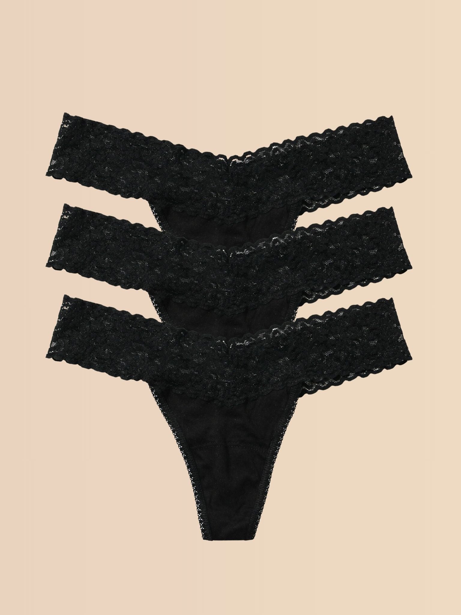 Black Lace Low Rise Thong 3-Pack Flat Lay on Cream - DreamEase™ | Hanky Panky