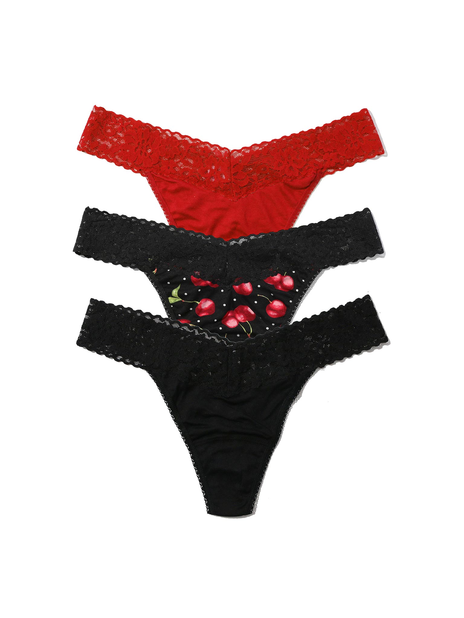 Two pairs of lace-trimmed panties, one red and one black with floral design, on a white background.