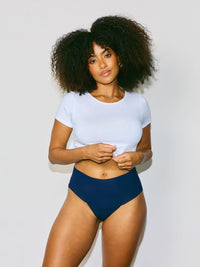 Model facing front in Navy underwear.