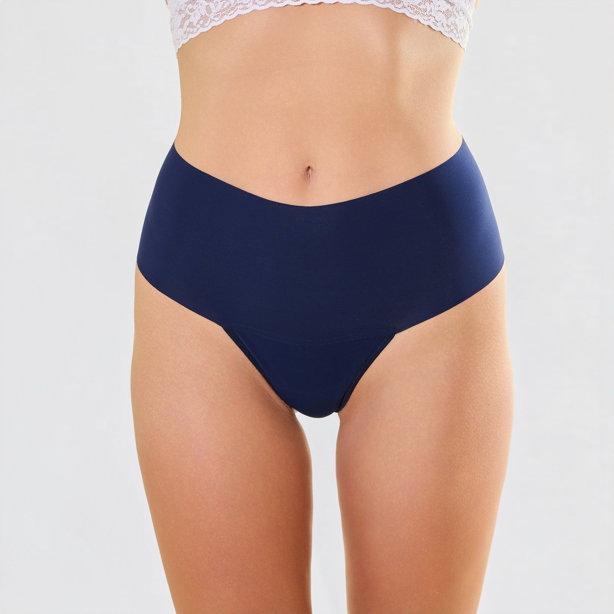 Model forward facing in navy underwear plain backround