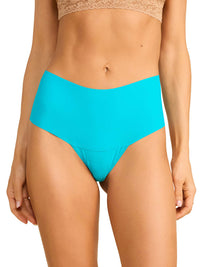 Turquoise bikini bottom worn by a person on a white background
