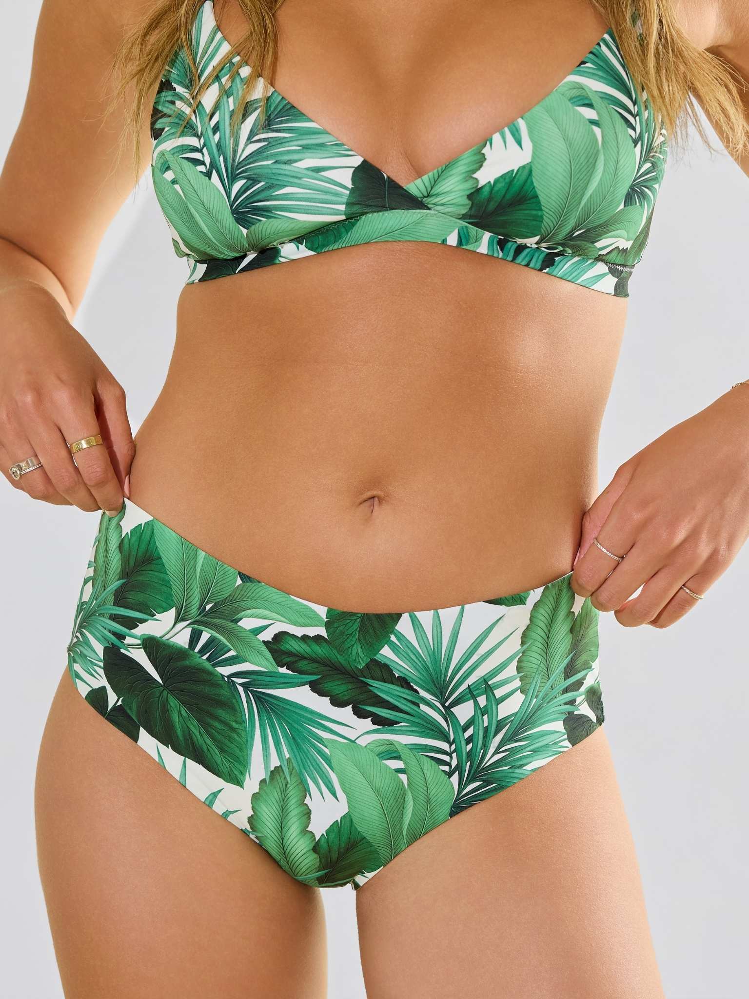 Model front view of Swim High Rise Bottom Stay Floral Palm Tree Green with matching top