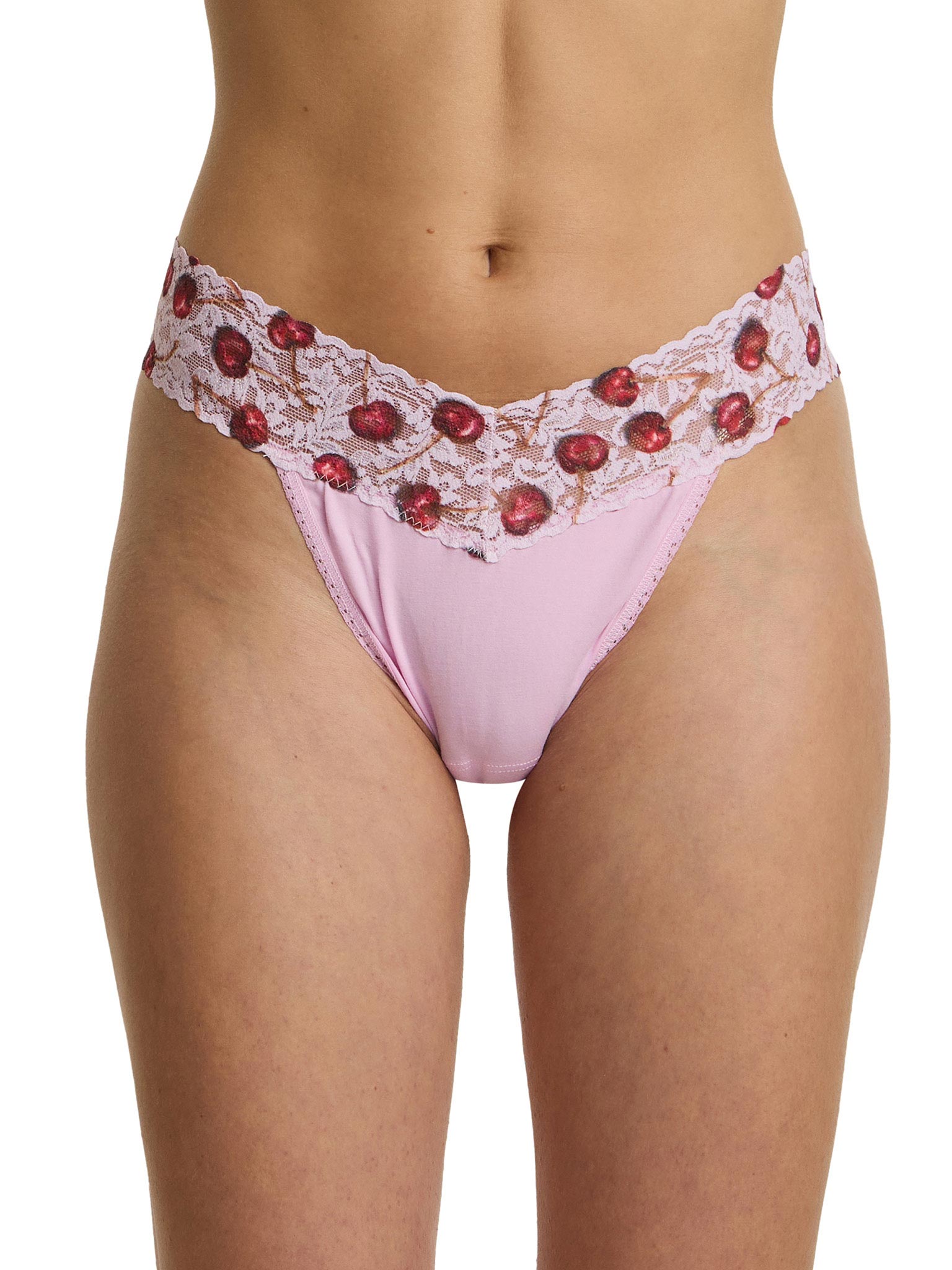 Pink lace underwear with red cherries on a white background