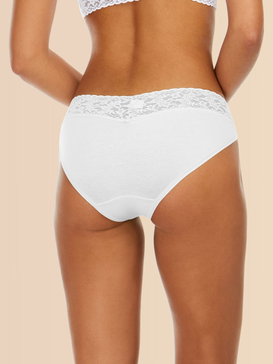 Model facing back wearing Supima® Cotton V-kini White