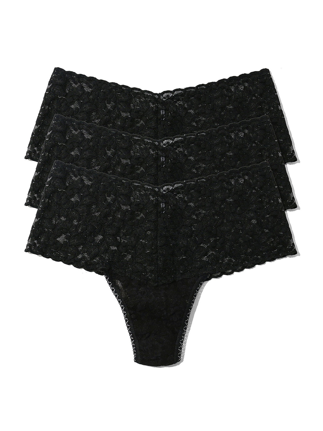 Three pairs of black lace underwear stacked on a white background
