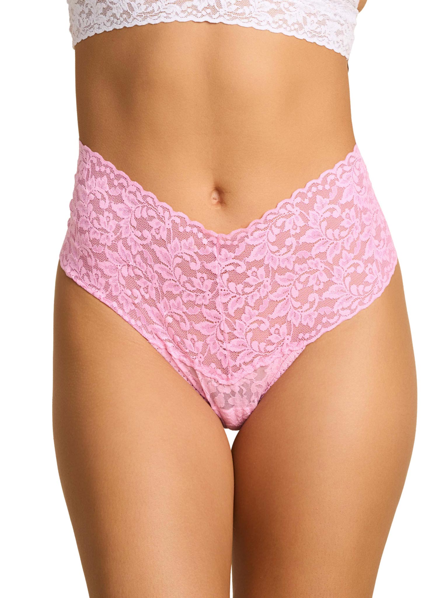 Pink lace underwear on a white background