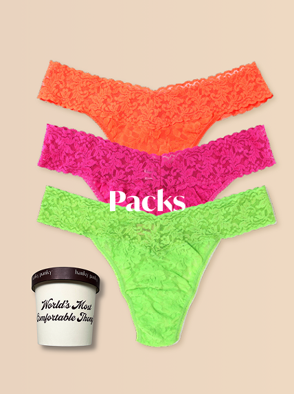 Three colorful lace thongs in orange, pink, and green with a container labeled 'World's Most Comfortable Ice' on a beige background.