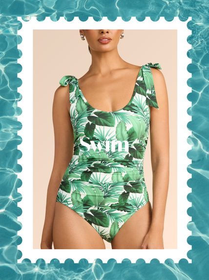Woman wearing a green leaf-patterned swimsuit with 'Swim' text, framed by water design.
