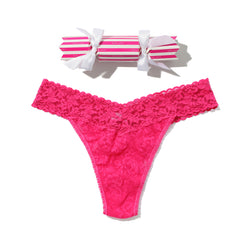 Pink lace thong with a striped box on a white background