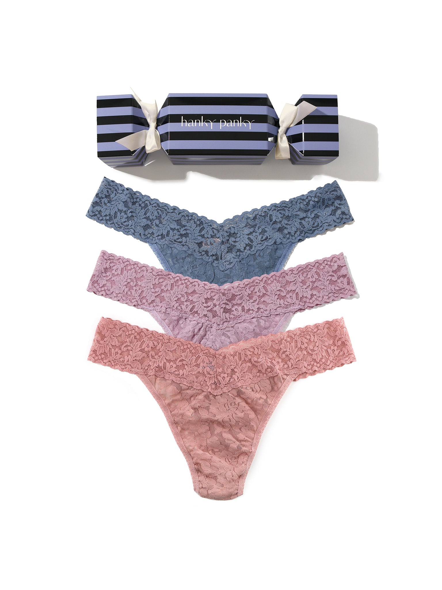 Set of lace underwear in blue and pink with striped candy canes on a white background