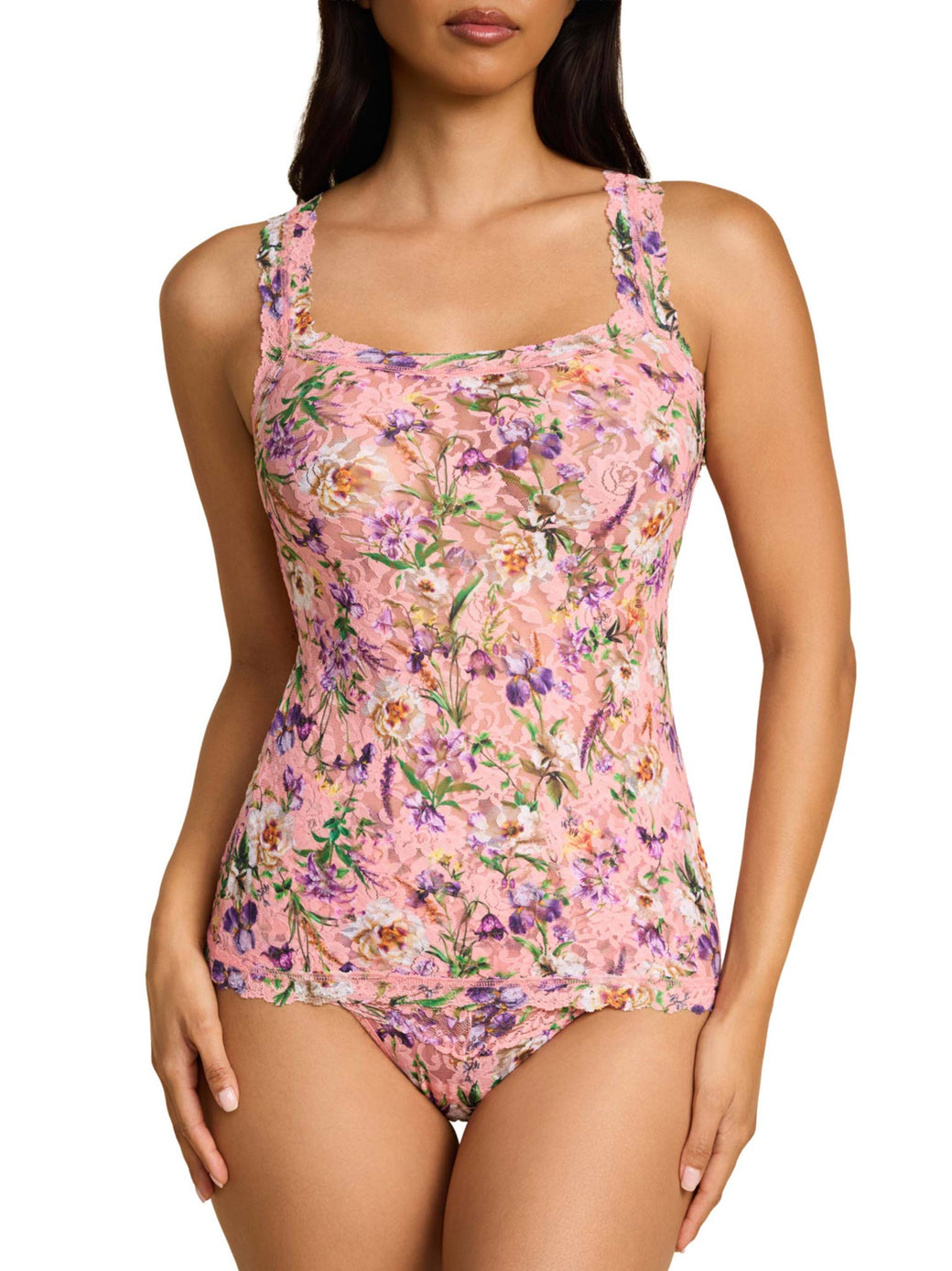 Floral patterned swimsuit worn by a model on a white background