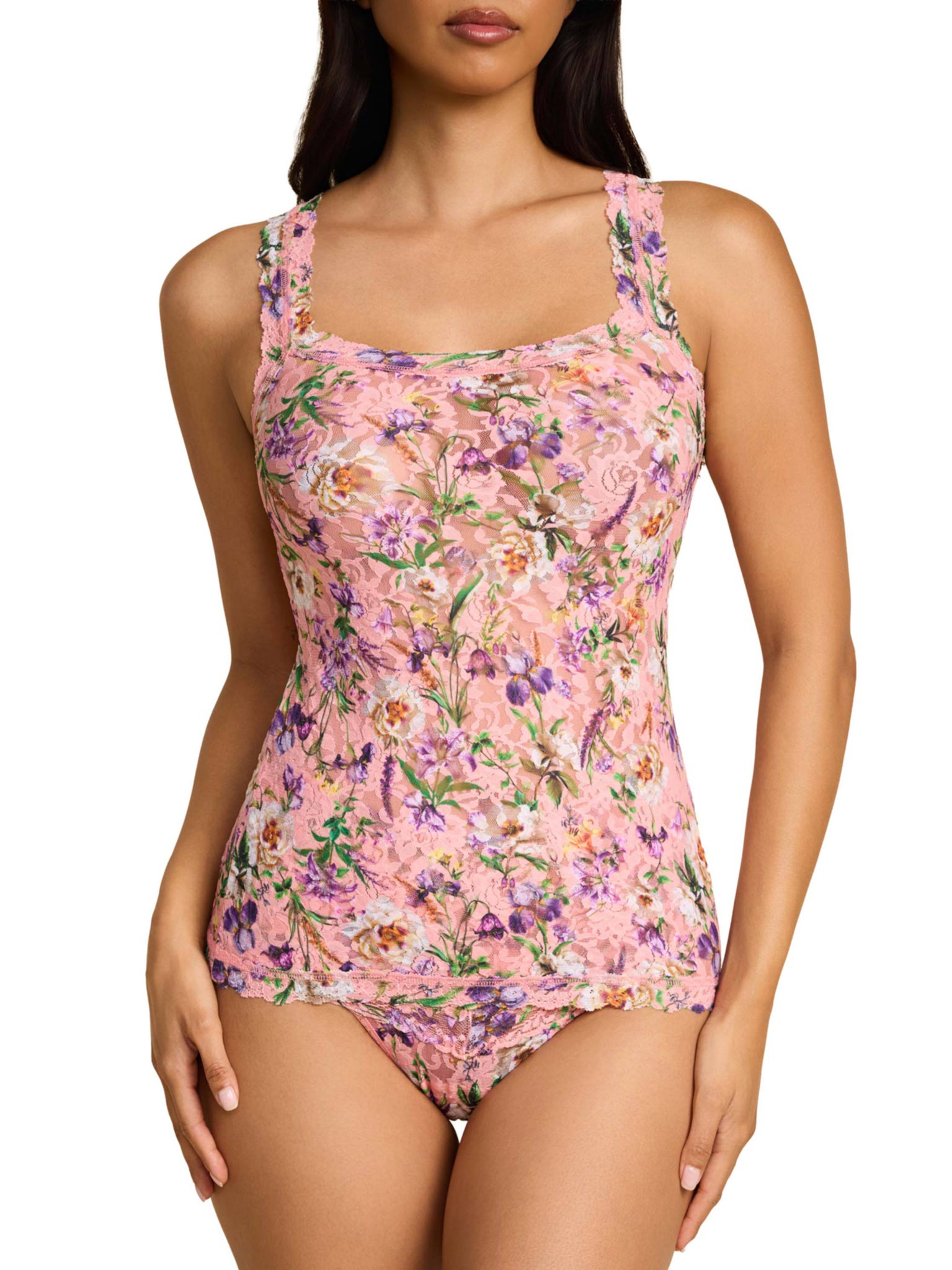 Floral patterned swimsuit worn by a model on a white background
