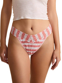 Red and white striped beach thong bottom worn by a person on a white background