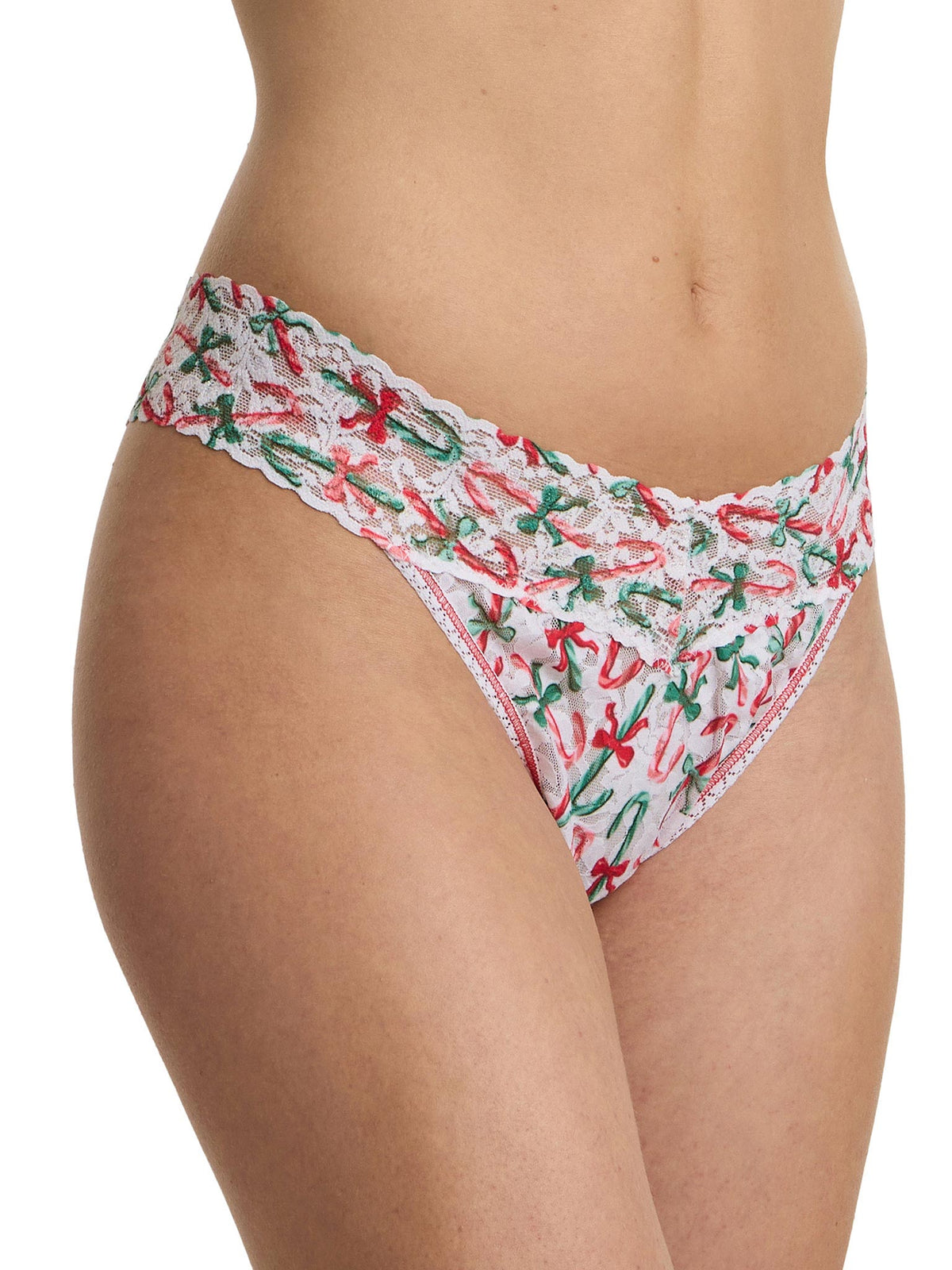 White lace thong with red and green floral pattern on a white background
