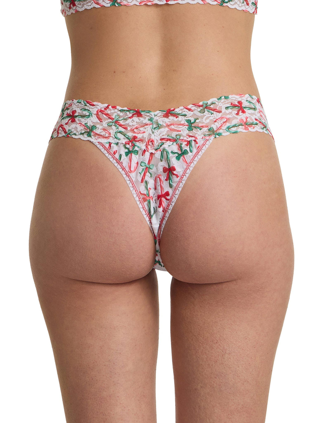 Bikini bottom with festive bow pattern on a white background