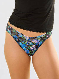 Model facing front in Printed Signature Lace® Low Rise Thong Ocean Blooms Black