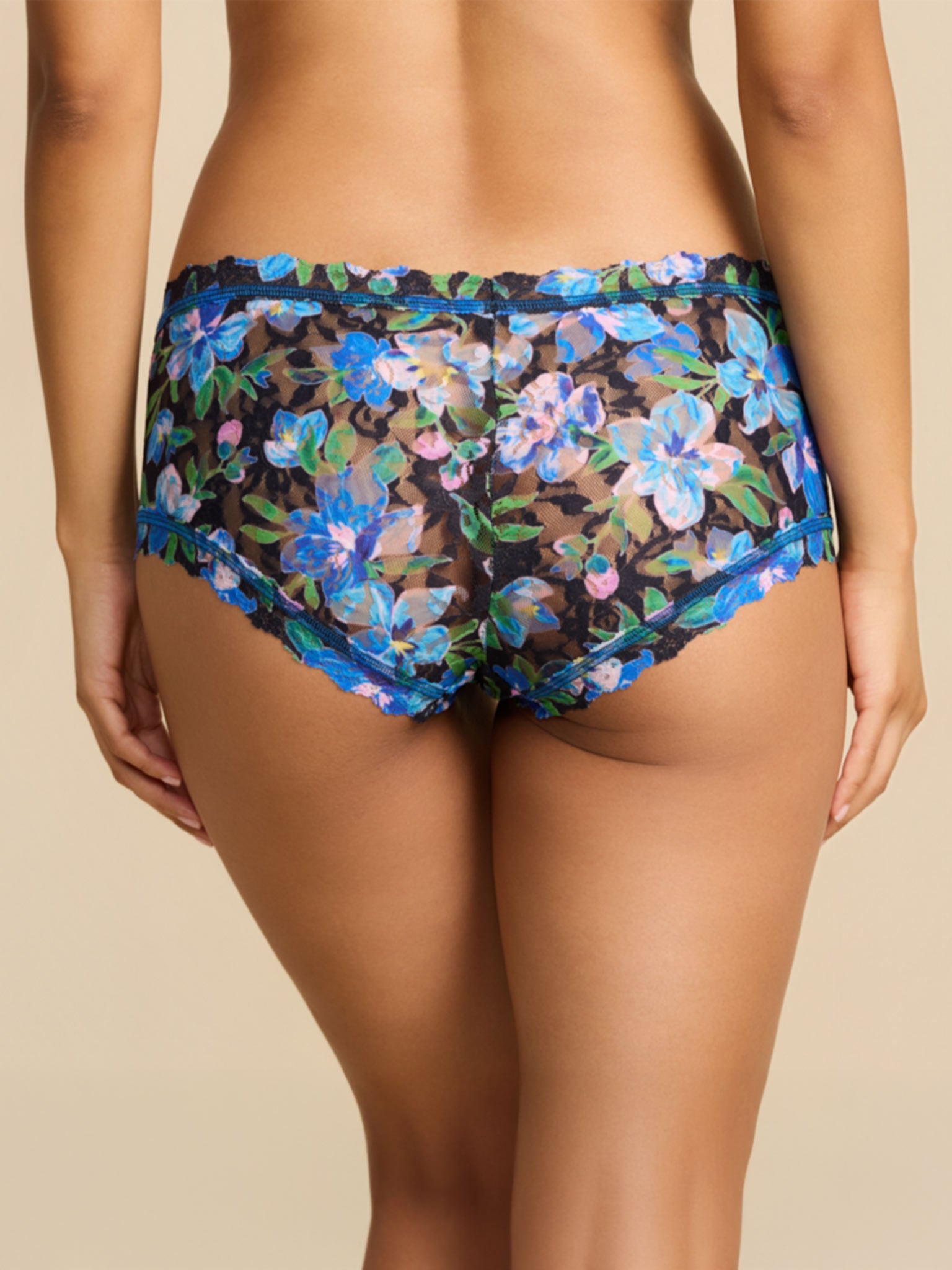 Model facing back in Printed Signature Lace® Boyshort Ocean Blooms Black