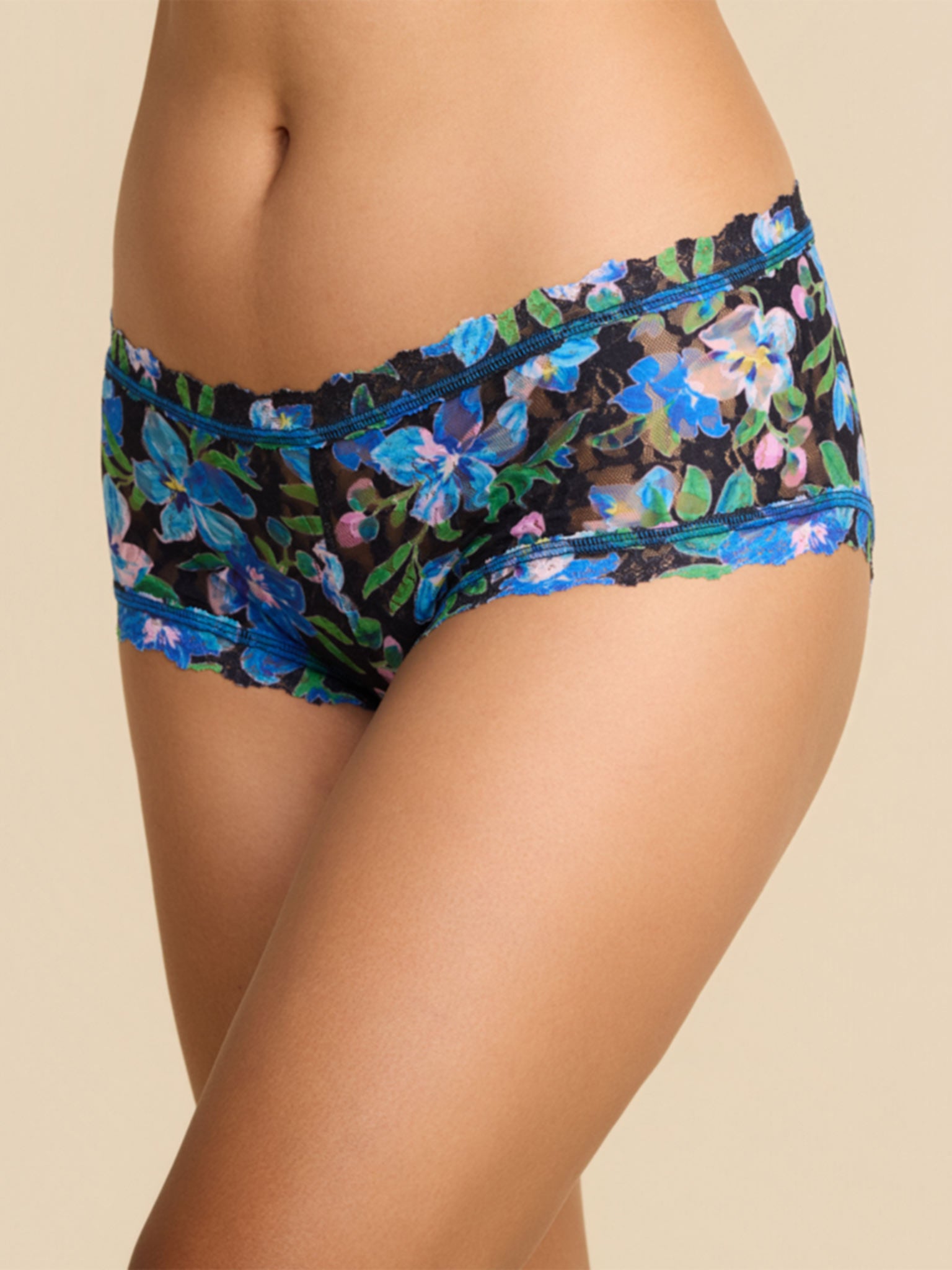 Model facing side in Printed Signature Lace® Boyshort Ocean Blooms Black