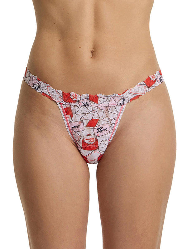 Red and white patterned g-string on a plain background