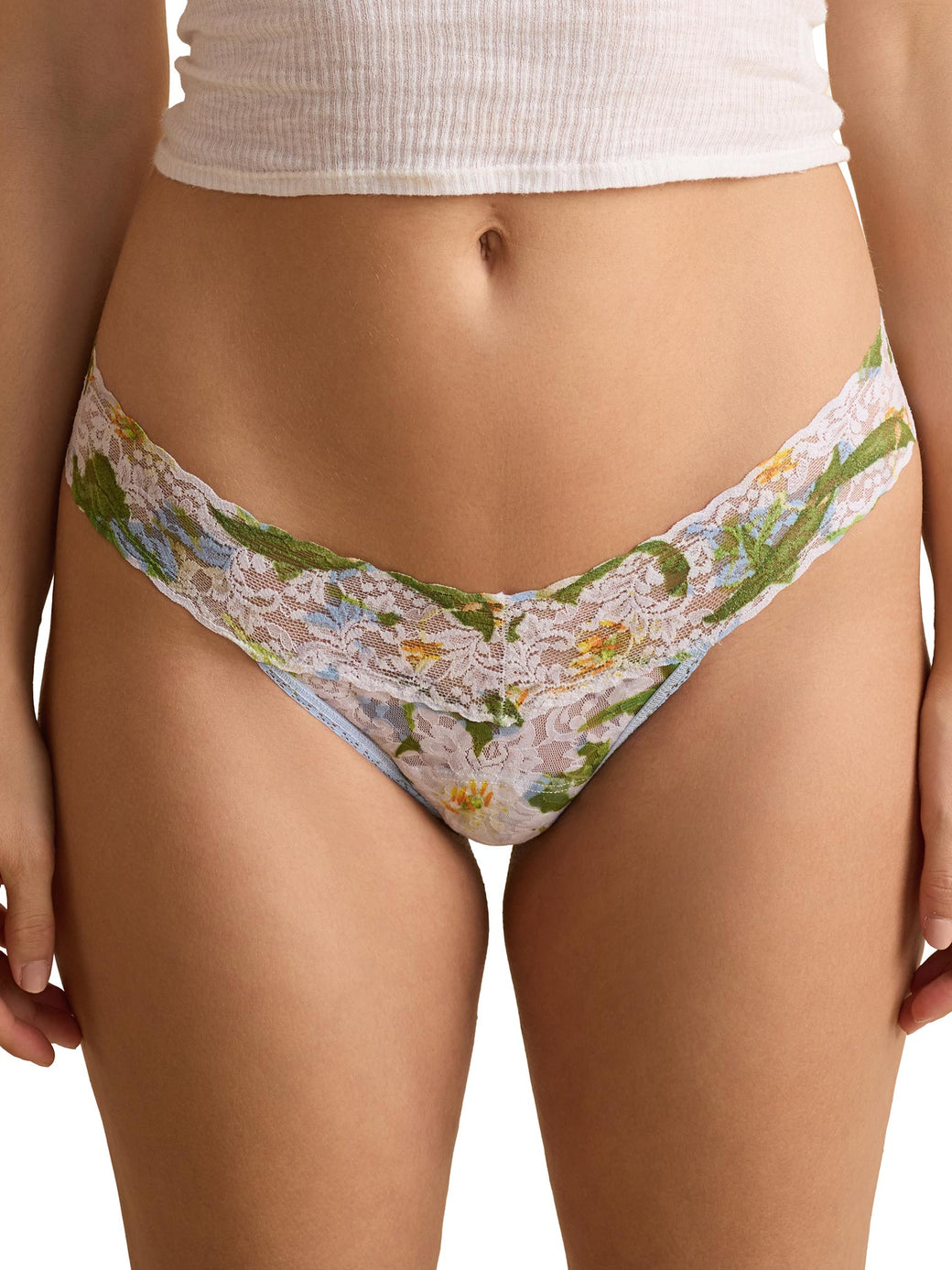 Floral-patterned underwear worn by a person on a white background