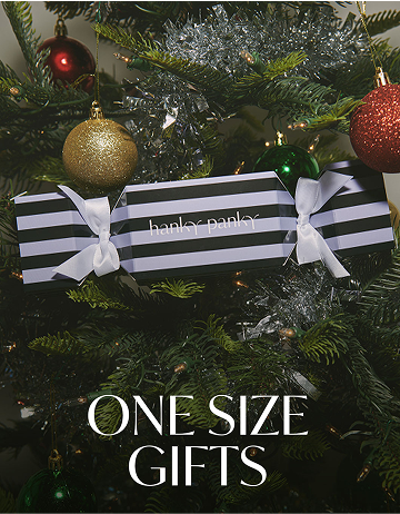 Black and white striped box with a bow on a Christmas tree, featuring 'hankor parker' branding.