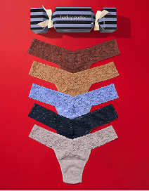 Set of women's underwear in various colors on a red background