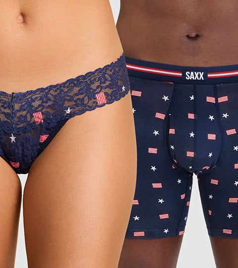 Navy patterned underwear with lace detail on a plain background